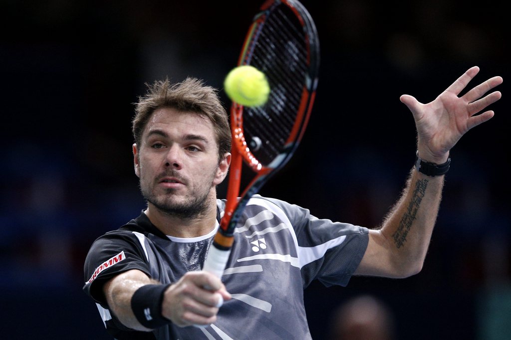 epa04469973 Stan Wawrinka of Switzerland returns the ball to Kevin Anderson of South Africa during his round of sixteen match at the BNP Paribas 2014 Masters tennis tournament in Paris, France, 30 October 2014.  EPA/YOAN VALAT