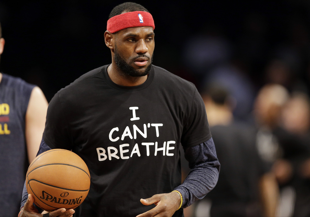 Cleveland Cavaliers' LeBron James warms up before an NBA basketball game against the Brooklyn Nets at the Barclays Center, Monday, Dec. 8, 2014, in New York. Professional athletes have worn "I Can't Breathe" messages in protest of a grand jury ruling not to indict an officer in the death of a New York man. (AP Photo/Frank Franklin II)