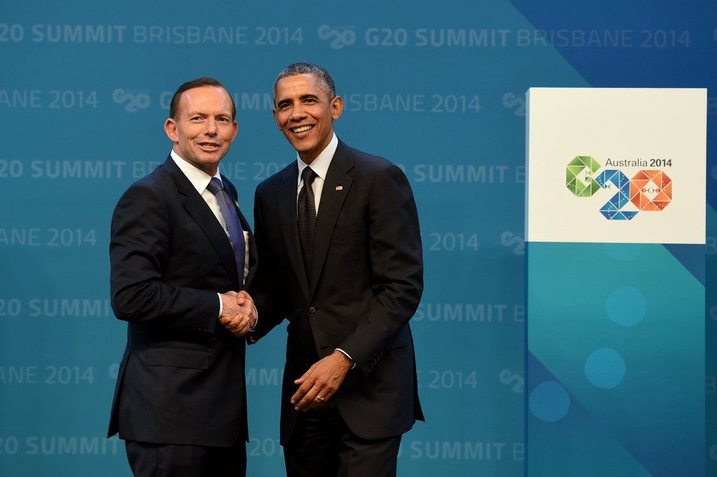 epa04490257 Australian Prime Minister Tony Abbott (L) greets US President Barack Obama (R) during the G20 summit official welcome at the Brisbane Convention and Exhibitions Centre (BCEC) in Brisbane, Australia 15 November 2014. The G20 summit will be held in Brisbane on 15 and 16 November. The G20 represents 90 percent of global gross domestic product, two-thirds of the world's people and four-fifths of international trade.  EPA/LUKAS COCH AUSTRALIA AND NEW ZEALAND OUT