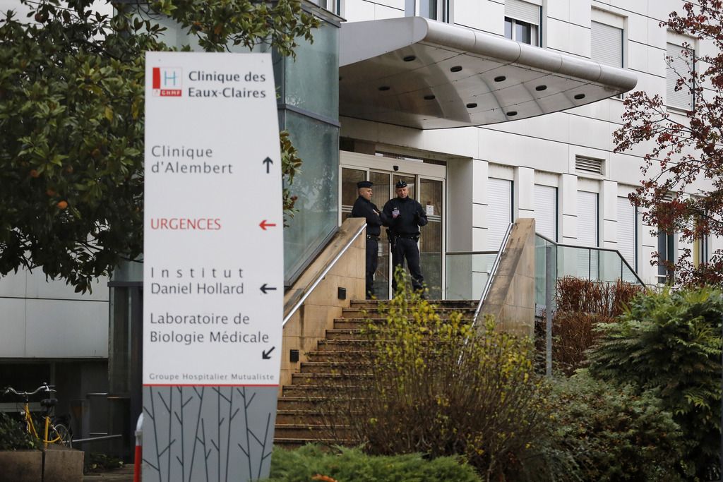 Police officers stand in front of the Clinique d?Alembert in Grenoble, French Alps, where Algerian President Abdelaziz Bouteflika has been admitted, Saturday, Nov. 15, 2014. The ailing 77-year-old leader was admitted to the hospital on Thursday, according to the officials. Neither official could say why Bouteflika was hospitalized. (AP Photo/Laurent Cipriani)