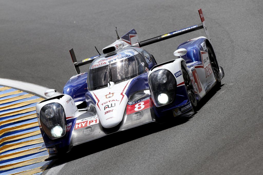 epa04256708 Toyota Racing with a Toyota TS 040 Hybrid N? 8 driven by Anthony Davidson of Great Britain, Nicolas Lapierre of France and Sebastien Buemi of Switzerland compete in the Le Mans 24 Hours race in Le Mans, France, 14 June 2014. The race started at 3pm and is scheduled to finish at 3pm on the 15th  EPA/EDDY LEMAISTRE