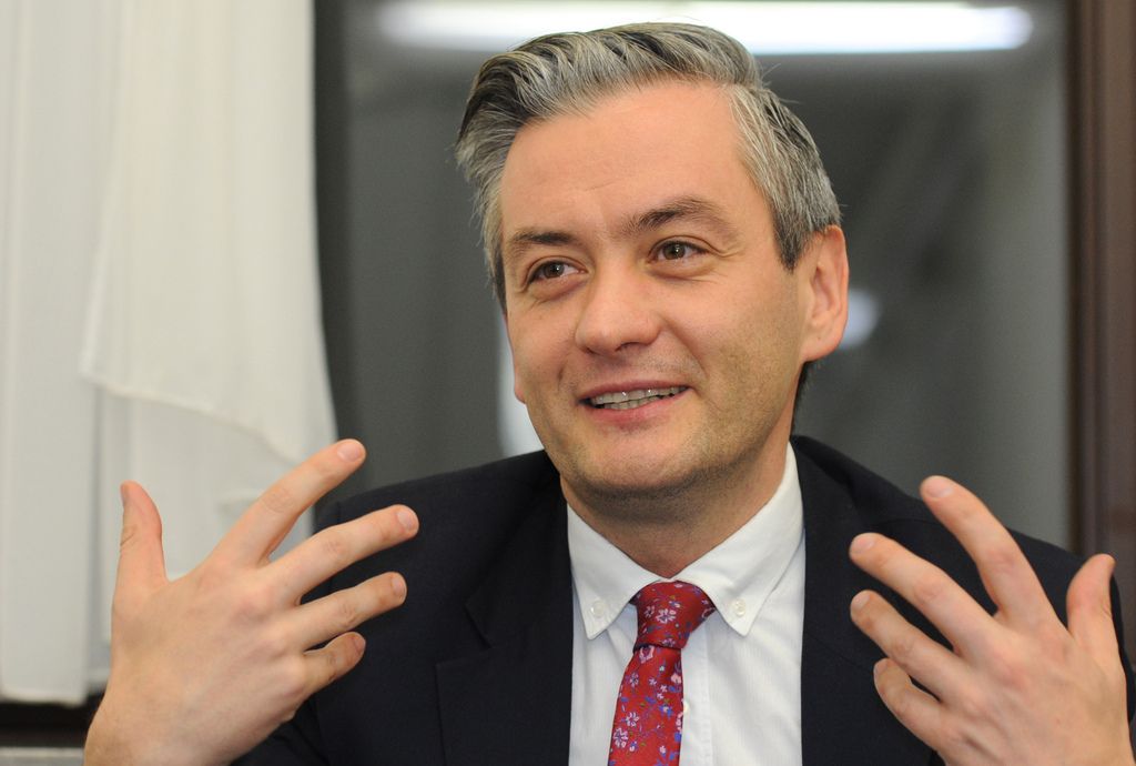 In this  Nov. 28, 2014 photo ,  lawmaker Robert Biedron, Poland?s first openly gay lawmaker, speaks to The Associated Press at the parliament building in Warsaw, Poland. Biedron, 38, was elected Sunday Nov. 30, 2014  to be the mayor of the northern Polish city of Slupsk, making him also the first openly gay mayor in Poland. His political success comes amid growing social acceptance for gays and lesbians in Poland, a conservative and mostly Roman Catholic country. (AP Photo/Alik Keplicz)