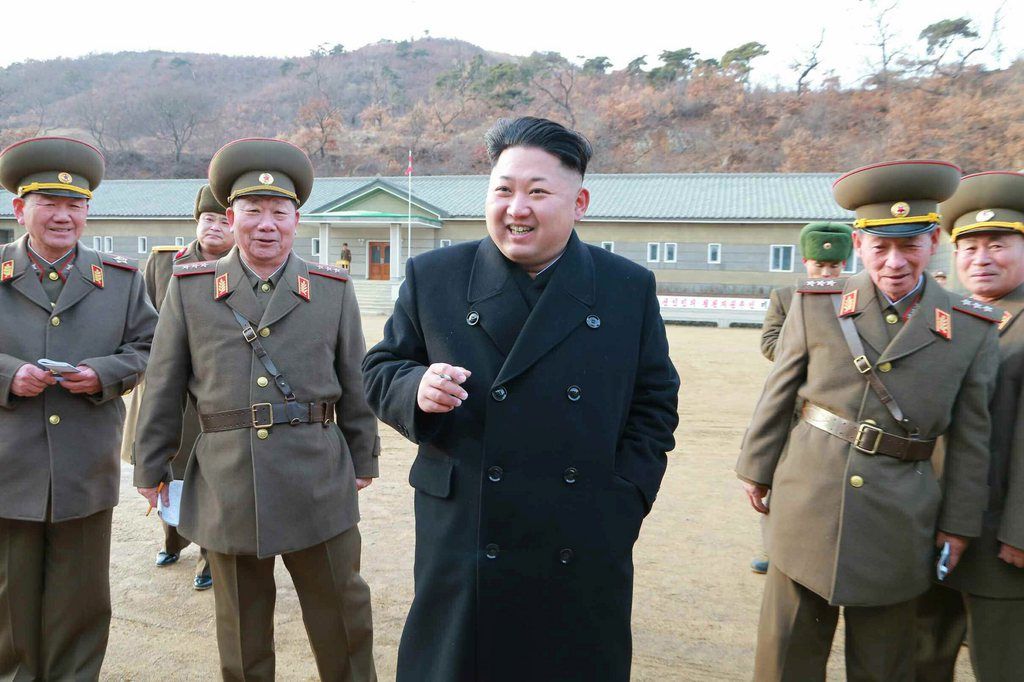 epa04511339 An undated picture released by the Rodong Sinmun, the newspaper of North Korea's ruling Workers Party, on 02 December 2014 shows North Korean leader Kim Jong-un talking to soldiers during his visit to an artillery unit at an undisclosed location, North Korea.  EPA/RODONG SINMUN SOUTH KOREA OUT