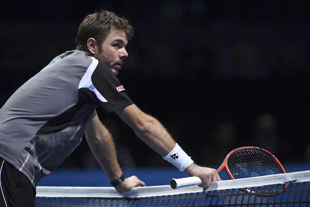 Stanislas Wawrinka of Switzerland, returns the ball to Dominic Thiem of Austria, during their second round match at the ATP World Tour Masters tennis tournament at Bercy stadium in Paris, France, Wednesday, Oct. 29, 2014. (AP Photo/Michel Euler)