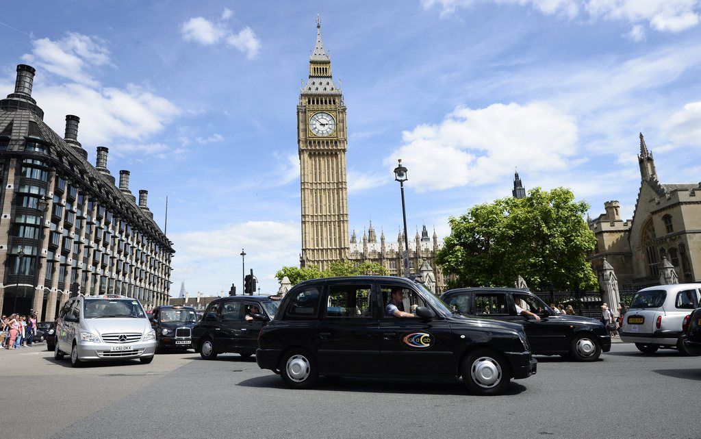 epa04249749 Taxi drivers protest around Westminster during a demonstration in London, Britain, 11 June 2014. Traffic in several European cities was severely disrupted Wednesday as thousands of taxi drivers blocked key arteries to protest inroads made by new mobile cab-booking services led by US firm Uber. The taxi industry complains that the likes of Uber act like a taxi service without incurring the costs of a licence, undercutting traditional players.  EPA/FACUNDO ARRIZABALAGA