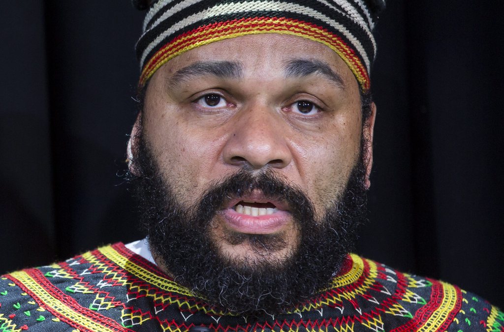 epa04015510 Controversial Franco-Cameroonian comedian Dieudonne M'bala M'bala holds a press conference at the Theatre de la Main d'Or in Paris, France, 11 January 2013. Dieudonne addressed the media following court rulings which imposed a state-backed ban on his comedy act because of the show's antisemitic content. Originally banned in the city of Nantes on 09 January, the show 'Le Mur' was also shut down in Tours, and permanently forbidden in Dieudonne's Main d'Or theatre in Paris. The comedian announced he has scripted a new comedy act which would theoretically circumvent the court-imposed ban.  EPA/IAN LANGSDON
