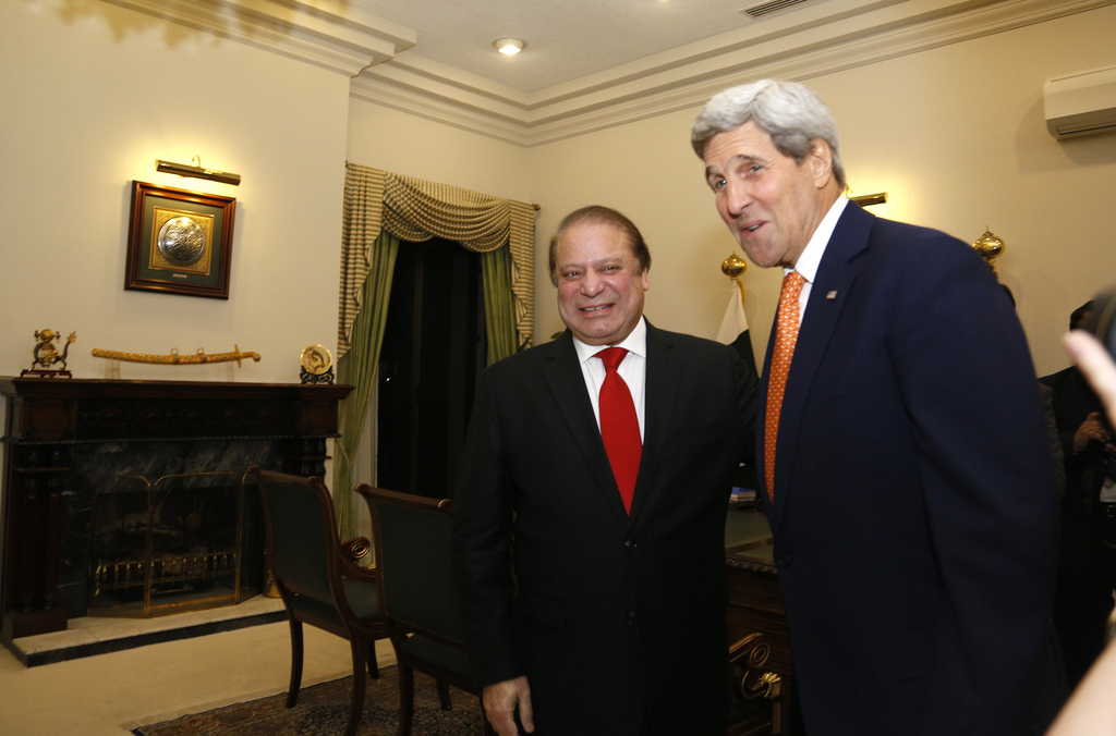 U.S. Secretary of State John Kerry is greeted by Pakistan Prime Minister Nawaz Sharif shortly after arriving in Islamabad, Pakistan Monday, Jan. 12, 2015. Kerry arrived in Pakistan on Monday to press the country's leadership to step up the fight against extremists and eliminate safe havens for terror groups along the Afghan border. Pakistan has been on edge ever since the Dec. 16 attack on the Peshawar school that was claimed by the Pakistani Taliban as retaliation for an army operation launched in June in the North Waziristan tribal area. (AP Photo/Rick Wilking, Pool)