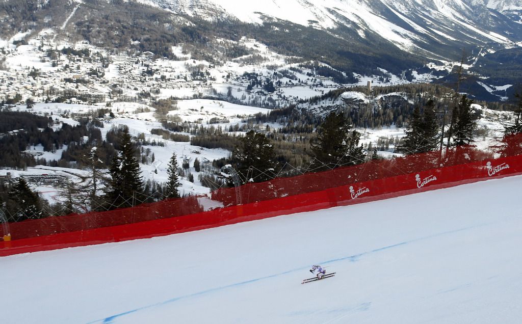 Britain's Chemmy Alcott speeds down the course to place 23rd at an alpine ski, women's World Cup super-g, in Cortina d'Ampezzo, Italy, Sunday Jan. 26, 2014. (AP Photo/Marco Trovati)