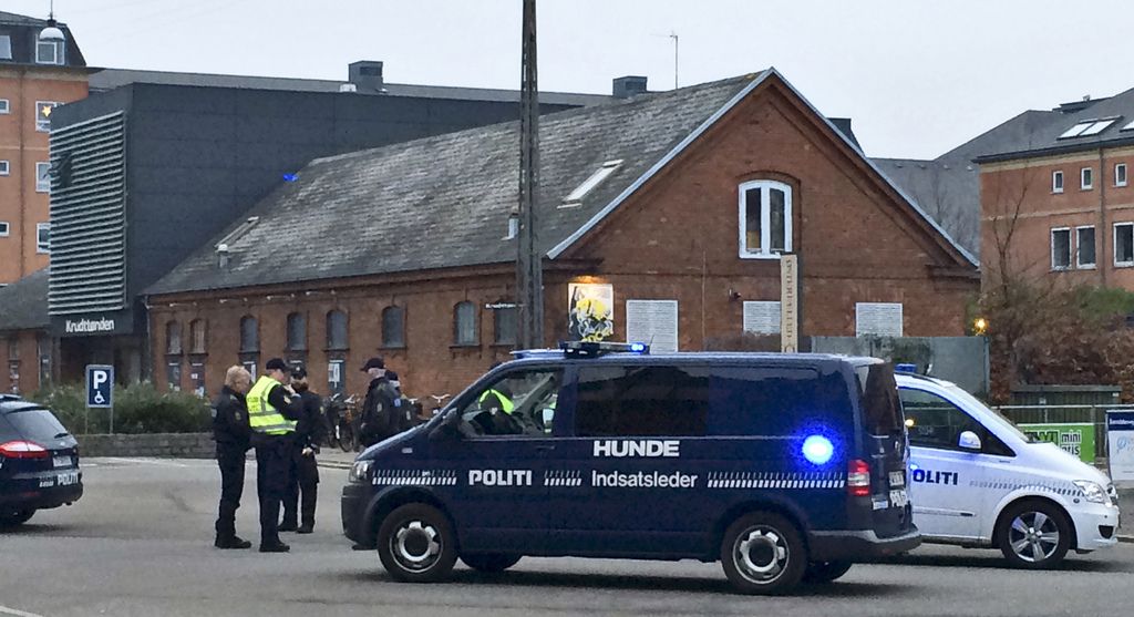 Emergency services gather outside a venue after shots were fired where an event titled "Art, blasphemy and the freedom of expression" was being held in Copenhagen, Saturday, Feb. 14, 2015. Danish media say several shots have been fired at a cafe in Copenhagen where a meeting about freedom of speech was being held, organized by Swedish artist Lars Vilks, who has faced numerous threats for caricaturing the Prophet Muhammad in 2007. (AP Photo/Polfoto, Janus Engel) DENMARK OUT