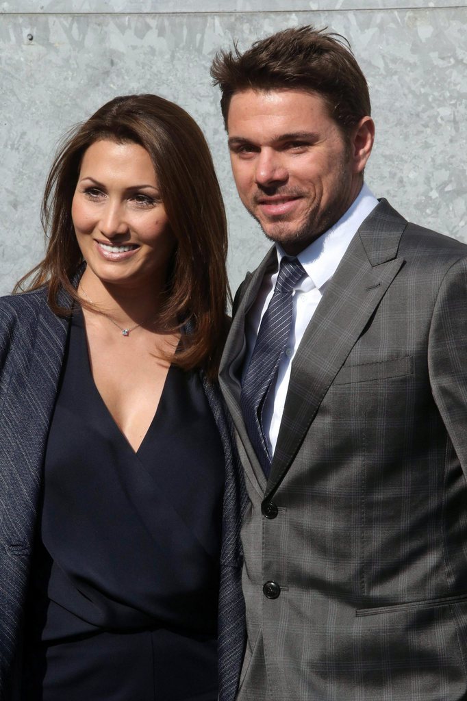 epa04098808 Swiss tennis player Stanislas Wawrinka (R) and his wife Ilham Vuilloud attend the presentation of the Fall/Winter 2014/2015 Women's collection of Italian designer Giorgio Armani during the Milan Fashion Week, in Milan, Italy, 24 February 2014. The Milano Moda Donna runs from 19 to 24 February.  EPA/MATTEO BAZZI