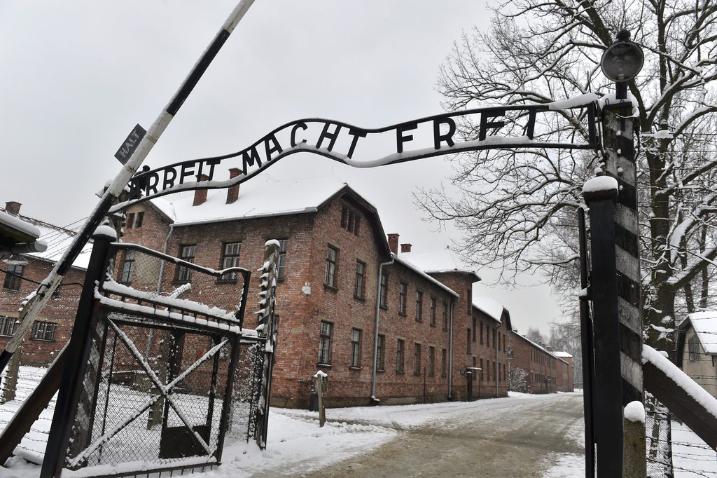 epa04585858 The main gate of the Auschwitz camp with a sign reading 'Work sets you free' at the former Nazi-German concentration and extermination camp KL Auschwitz in Oswiecim, Poland, 26 January 2015, ahead of the upcoming 70th anniversary of the liberation of the camp wich will be celebrated on 27 January 2015. On 27 January 1945, Soviet forces liberated the biggest German Nazi death camp.  EPA/JACEK BEDNARCZYK POLAND OUT