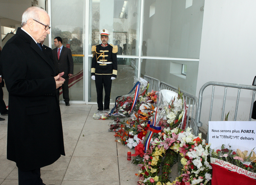 Tunisian's president Beji Caid Essebsi, left,  lays a wreath in memory of the victims of the terrorist attack at the Bardo Museum in Tunis, Sunday  March 22, 2015. The two extremist gunmen who killed 21 people at a museum in Tunis trained in neighboring Libya before caring out the deadly attack, a top Tunisian security official said. (AP Photo/Ali Louati)