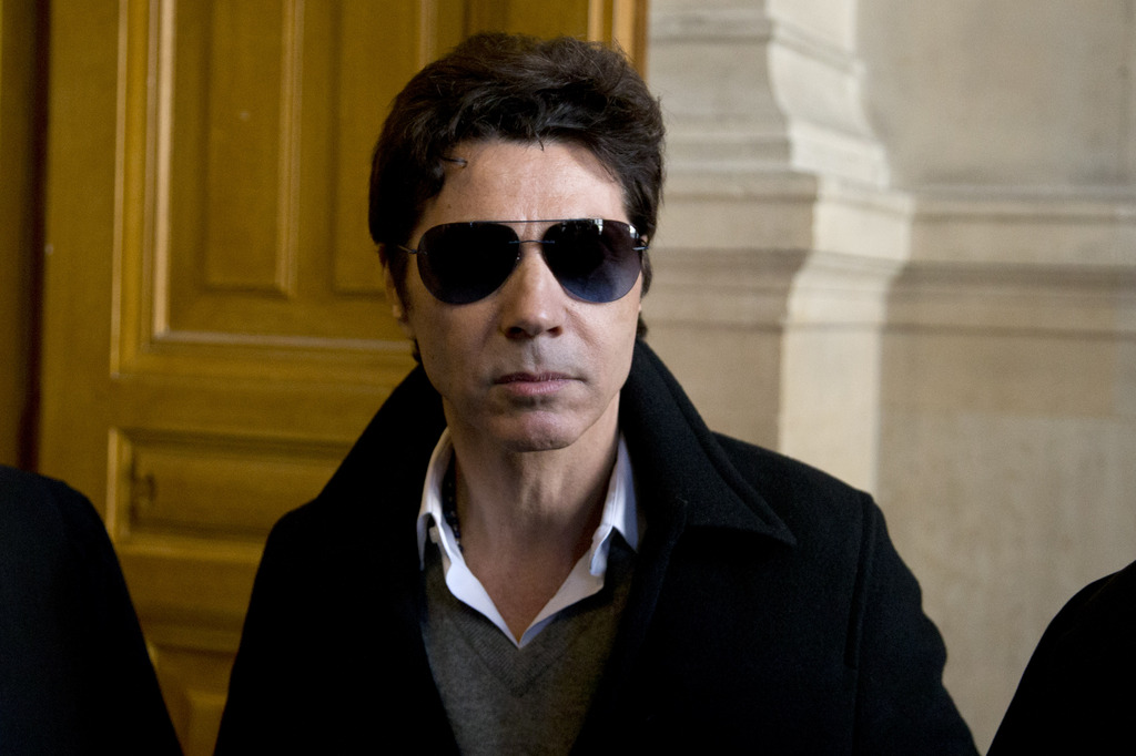 French singer Jean Luc Lahaye arrives at a Paris Court to attend a trial for corruption of female minor under the age of 15, in Paris, France, Monday, March 23, 2015. (AP Photo/Francois Mori)