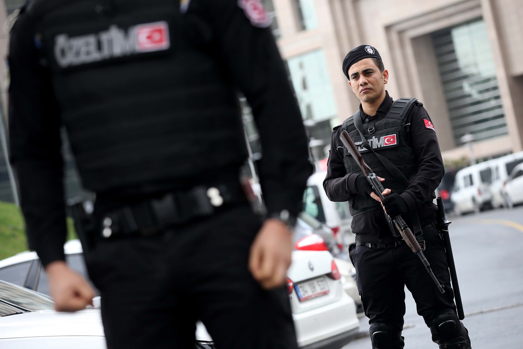 Members of special security forces stand outside the main courthouse in Istanbul, Turkey, Tuesday, March 31, 2015. Turkish news agencies say that members of a banned leftist group have taken a chief prosecutor hostage in his office inside the courthouse. State-run Anadolu Agency and state television, TRT, identified the prosecutor as Mehmet Selim Kiraz. He is the prosecutor investigating the death of a teenager who was hit by a police gas canister fired during nationwide anti-government protests in 2013.(AP Photo/Emrah Gurel)