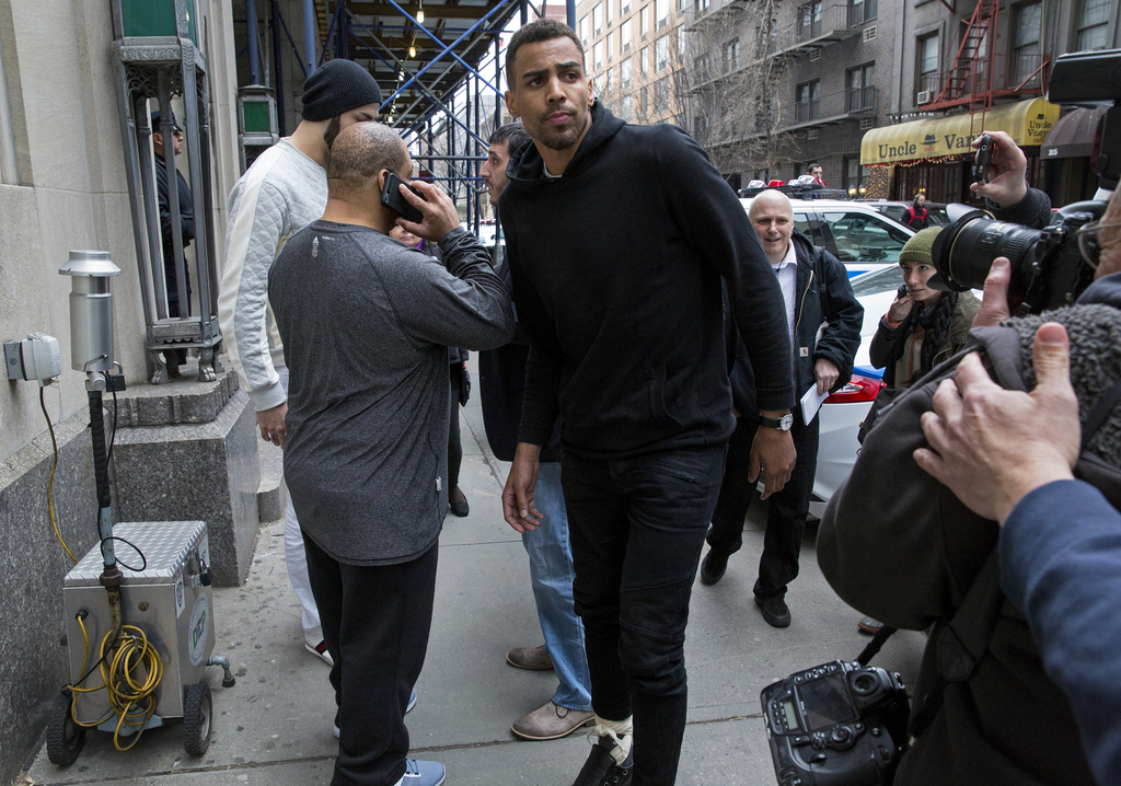 Atlanta Hawks NBA basketball players Thabo Sefolosha, center, and Pero Antic, back left, leave a courthouse in New York, Wednesday, April 8, 2015. The players have been released after their arrest on charges they blocked officers from setting up a crime scene following the stabbing of Indiana Pacers' Chris Copeland. (AP Photo/Craig Ruttle)