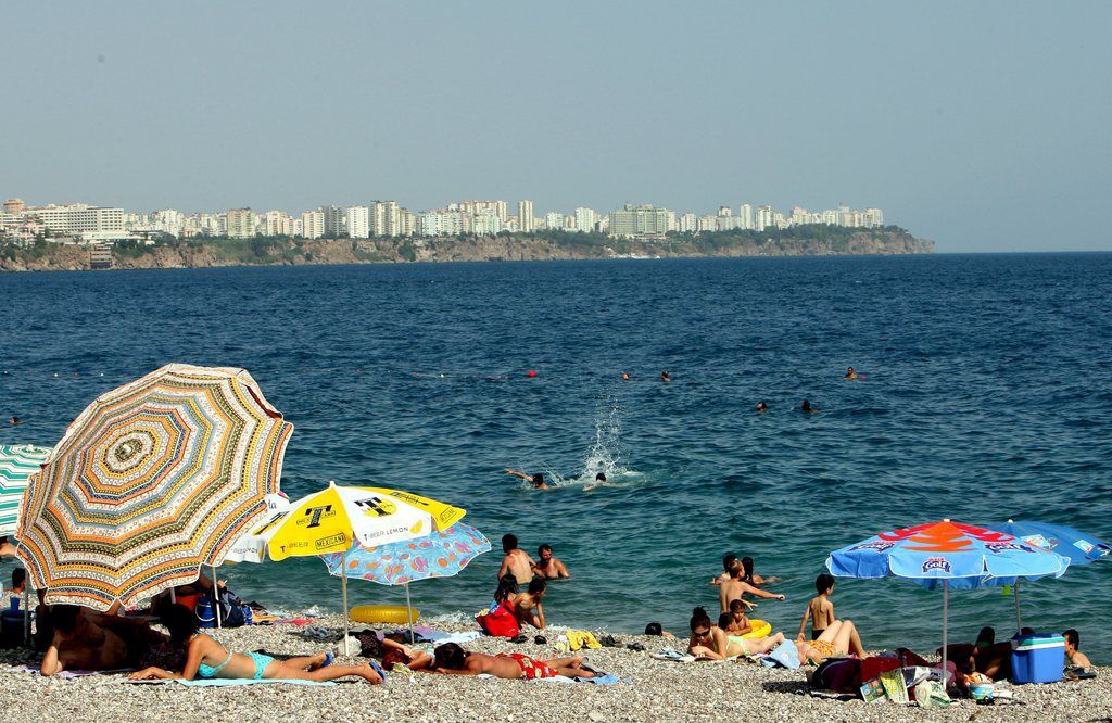 epa01048323 Turkish people enjoy in a sunny day at Konyaalti beach in Antalya, Turkey on 26 June 2007. German high school student Marco Weiss, 17, will stand trial at the Antalya Law Court on 06 July 2007. Weiss, a high school student from the town of Uelzen, has been detained since early April over allegations that he engaged in sex with a 13-year-old British girl referred to as Charlotte M.  EPA/TOLGA BOZOGLU