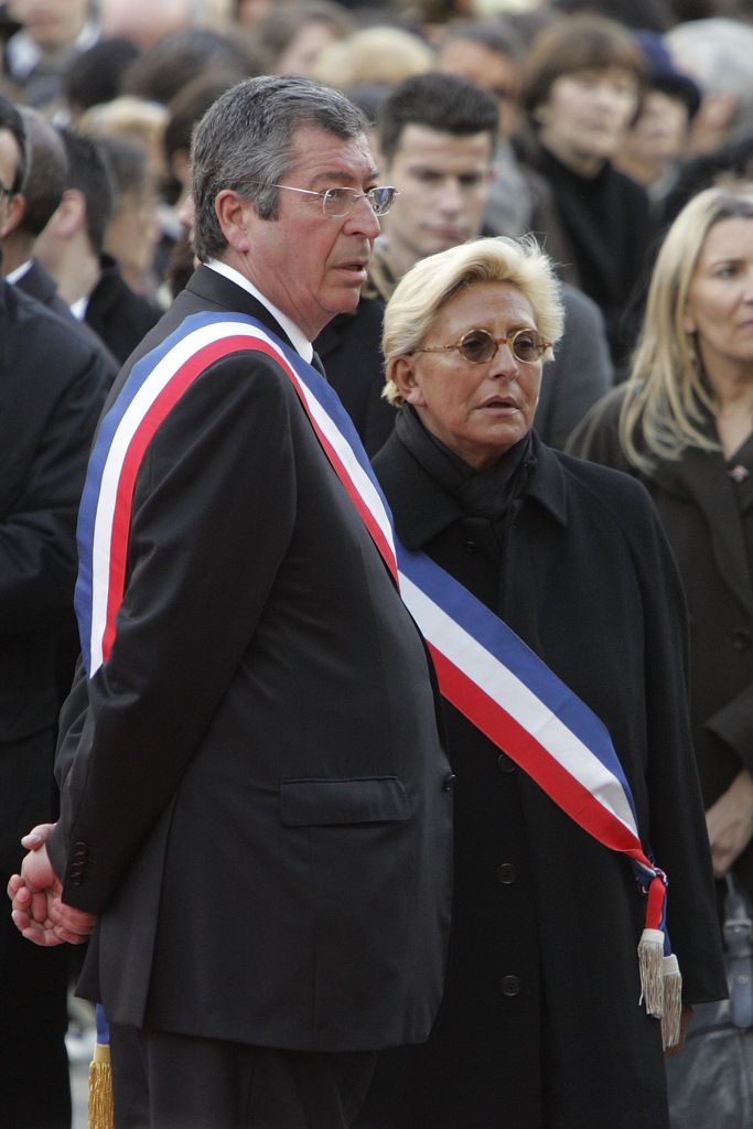 Levallois-Perret Mayor Patrick Balkany, left, and his wife Isabelle attend a ceremony for late French student Cecile Vannier, 17,  outside the Levallois-Perret townhall, near Paris, Monday, March 2, 2009. Vannier was killed last Feb. 22 by a bomb that went off in Cairo's 650-year-old Khan el-Khalili bazaar, as she was finishing a day touring with her fellow teenager  friends , some of whom were wounded. (AP Photo/Remy de la Mauviniere, pool)
