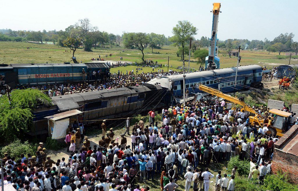 epa04671051 Rescuers work at the site of a train accident at Bachhrawan in Rae Bareli, Uttar Pradesh, India 20 March 2015. At least 22 people were killed and more than 50 injured in a train accident when two coaches of a passenger train travelling from the hill town of Dehradun to the temple city of Varanasi derailed in Rae Bareli district, a news reports said.  EPA/STRINGER