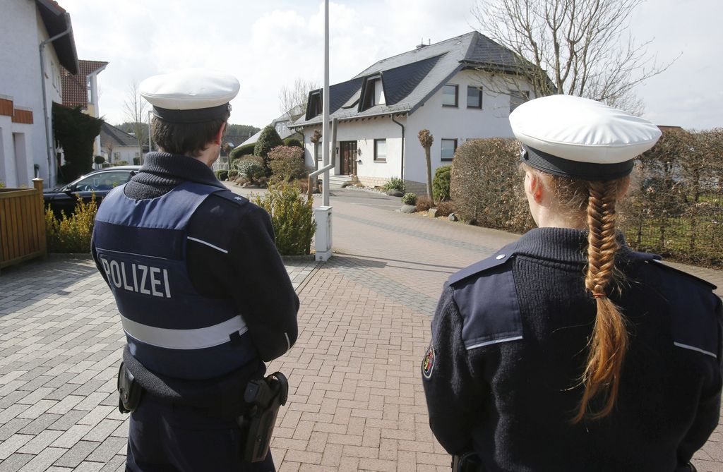 Police hold media away from the house where Andreas Lubitz lived in Montabaur, Germany, Thursday, March 26, 2015. Lubitz was the copilot on flight Germanwings 9525 that crashed with 150 people on board on Tuesday in the French Alps. (AP Photo/Michael Probst)