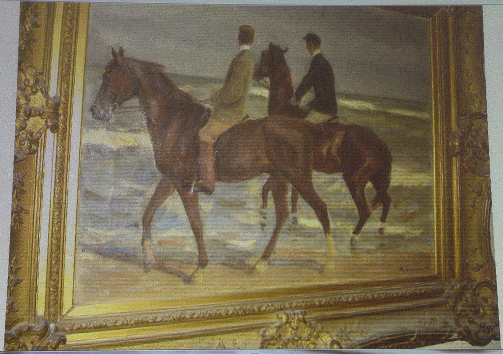 A painting from Max Liebermann "Zwei Reiter am Strande" ("Two riders on the beach") is projected on a screen during a news conference in Augsburg, southern Germany, Tuesday, Nov.5, 2013, on the art found in Munich. A hoard of more than 1,400 art works found last year at a Munich apartment includes previously unknown pieces by artists including Marc Chagall, German investigators said Tuesday, adding that they face a hugely complicated task to establish where the art came from. (AP Photo/Kerstin Joensson)