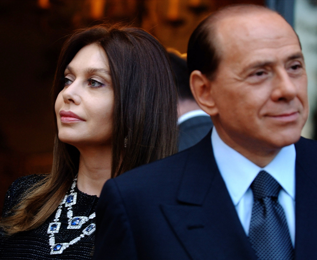 In this Friday June 24, 2004 photo, Italian premier Silvio Berlusconi, right, and his wife Veronica Lario wait for President George W. Bush and first lady Laura Bush at the Villa Madama residence for a social dinner, in Rome. On Thursday, Nov. 26, 2009 leading Italian newspaper Corriere della Sera says Premier Silvio Berlusconi's wife is seeking euro 43 million ($65 million) a year in alimony in her divorce case against her husband in the wake of a sex scandal. The newspaper also says Thursday that Berlusconi has rebuffed Veronica Lario's demand, which works out to more than ?3.5 million (about $5.3 million) monthly. (AP Photo/Susan Walsh)