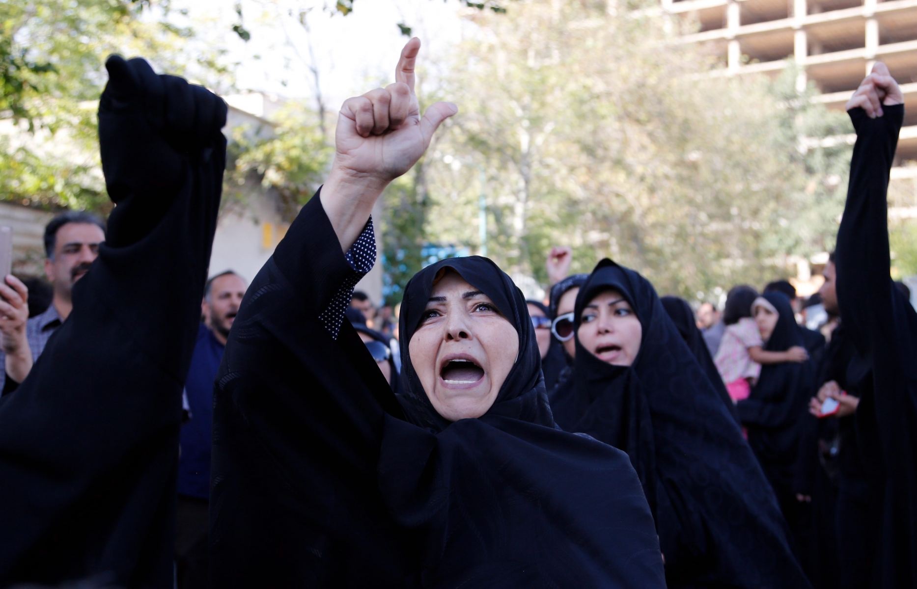 epa04952680 Iranian demonstrators chant slogans during a protest against Saudi Arabia over the hajj stampede in front of the Saudi embassy in Tehran, Iran, 27 September 2015. Iran's Supreme Leader Ali Khamenei on 27 September demanded Saudi Arabia apologize for this week's haj stampede in which 769 pilgrims died, including 144 Iranians. Iran has in the past few days been scathingly critical of its regional rival, Saudi Arabia, accusing it of mishandling the haj. Saudi media has accused Iran of trying to make political gains from the catastrophe.  EPA/ABEDIN TAHERKENAREH
