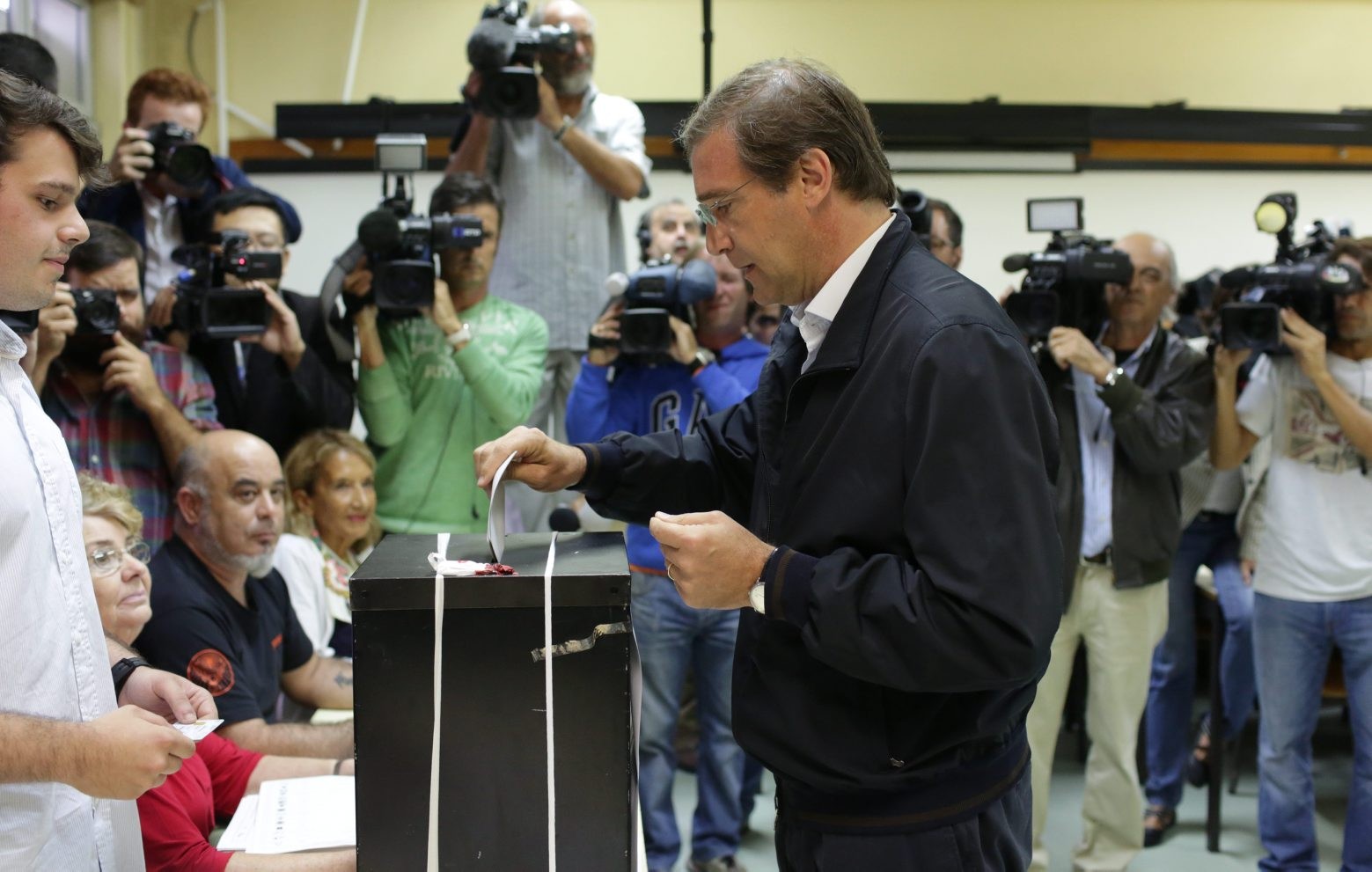Portuguese Prime Minister Pedro Passos Coelho casts his ballot in Portugal's general elections Sunday, Oct. 4, 2015, in Massama, outside Lisbon. The last polls ahead of Sunday's election showed the center-right ruling coalition roughly level  with the center-left Socialist Party, the main opposition. (AP Photo/Armando Franca) Portugal Elections