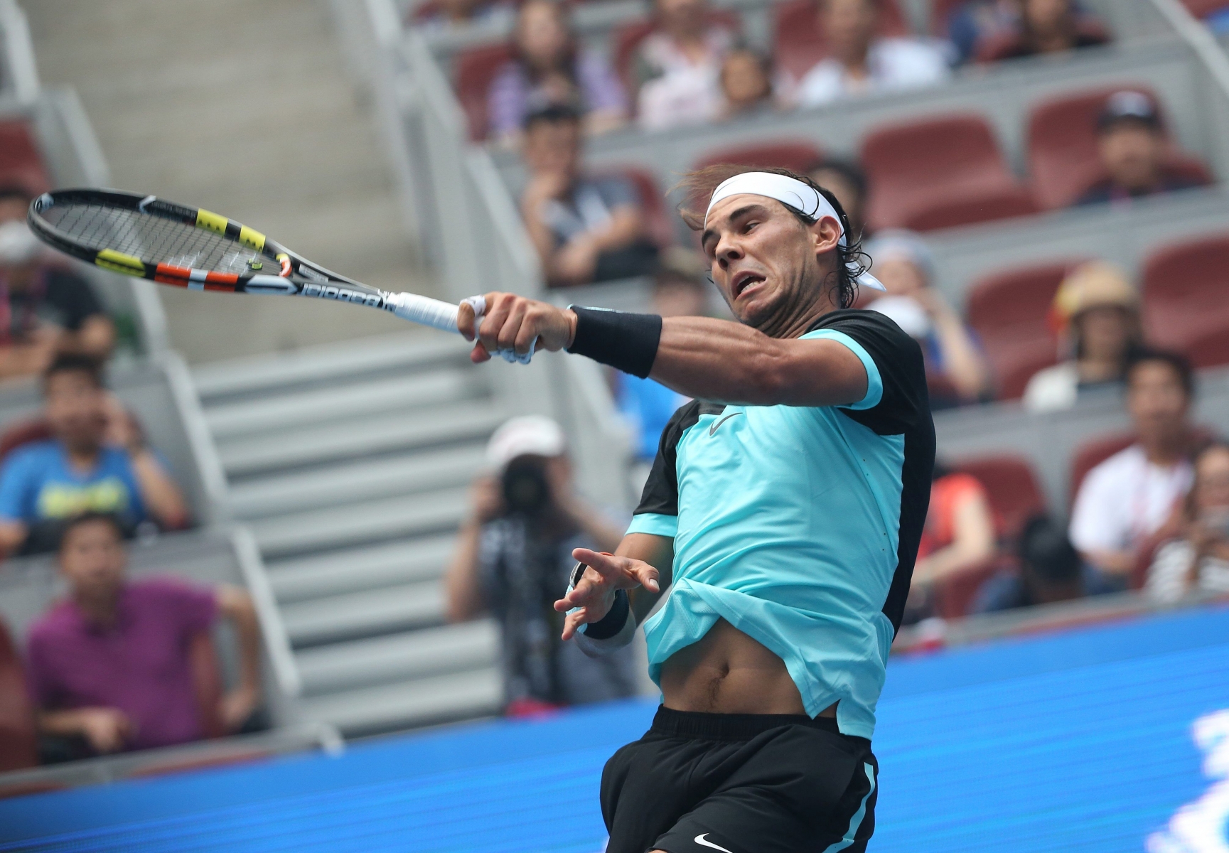 epa04965360 Rafael Nadal of Spain in action against Wu Di of China during their first round match in the China Open tennis tournament at the National Tennis Center in Beijing, China, 06 October 2015.  EPA/HOW HWEE YOUNG