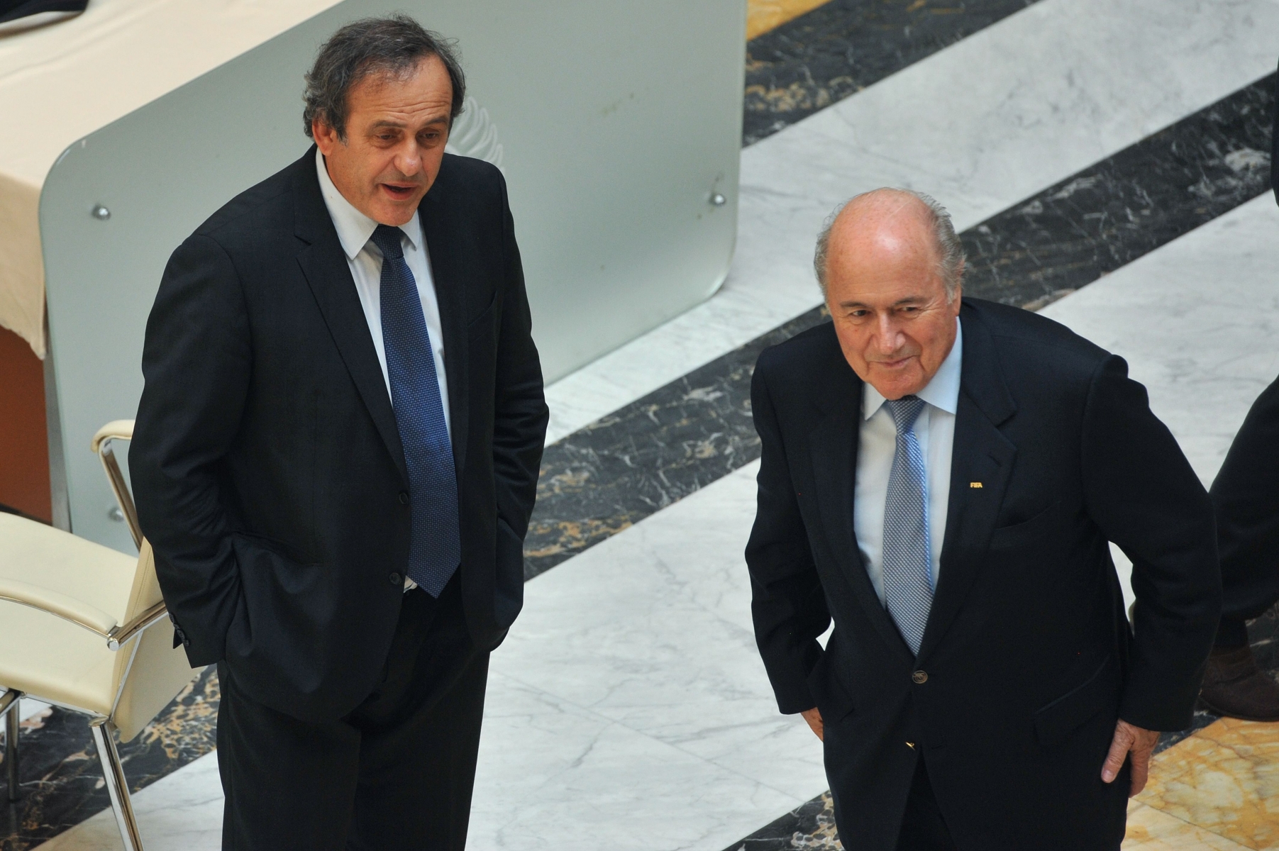 FILE - In this May 23, 2012 file photo UEFA President Michel Platini and FIFA President Joseph Blatter, from left, arrive at the meeting of the Confederation of North, Central American and Caribbean Association Football (CONCACAF), prior to the two-day congress of FIFA in Budapest, Hungary.  On Thursday, Oct. 8, 2015 FIFA provisionally banned President Sepp Blatter and UEFA President Michel Platini for 90 days. (MTI, Szilard Koszticsak/MTI via AP, file) Soccer FIFA Platini