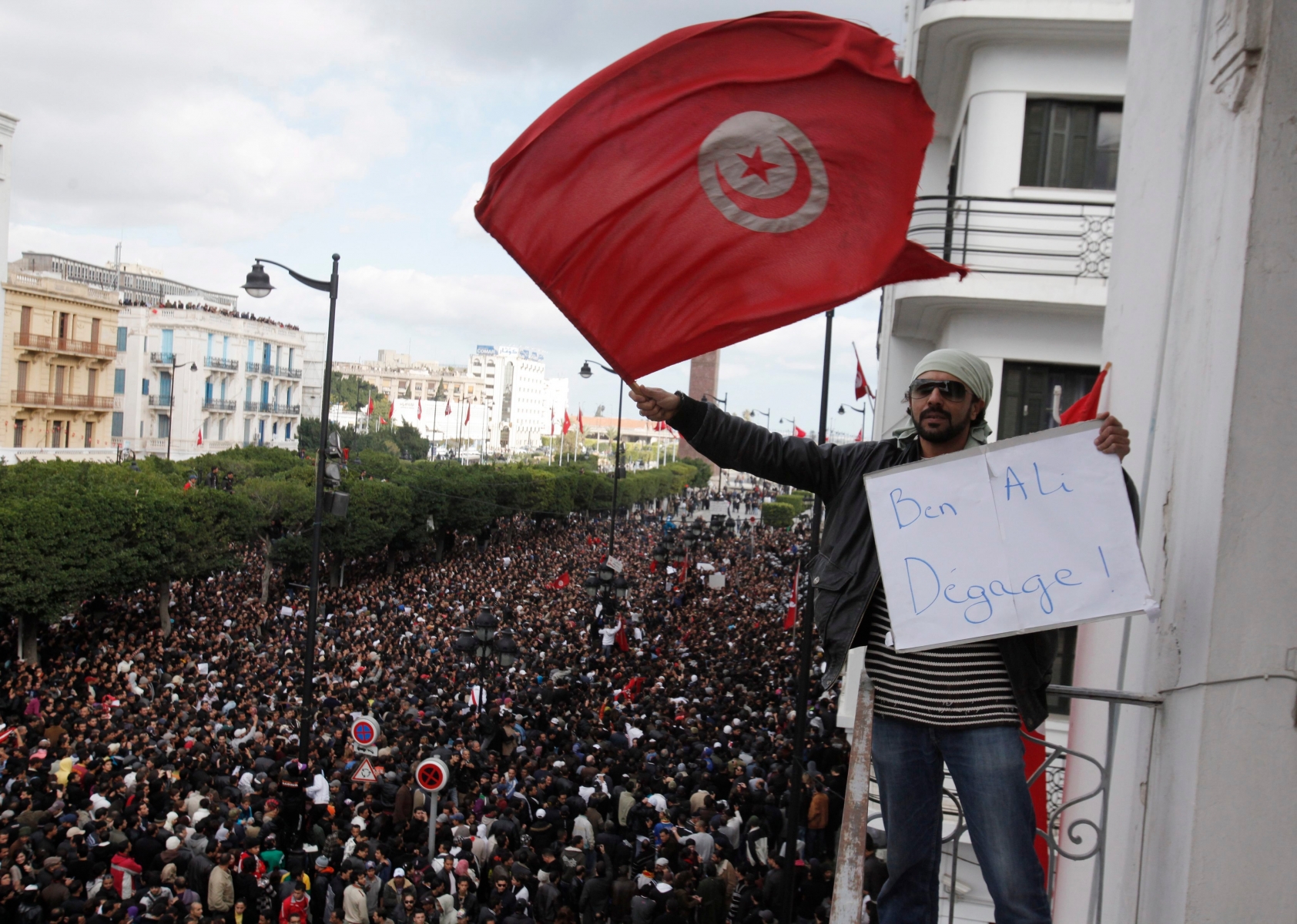 epa02531383 A photograph made available on 15 January 2011 showing demonstrators during a protest against Tunisian President Zine El Abidine Ben Ali, in Tunis, Tunisia, 14 January 2011, after Tunisian President Zine El Abidine Ben Ali's address to the nation. Reports state that Ben Ali said he would not seek another term in office and ordered police to stop firing on protesters as he sought to quell mounting unrest. The 74-year-old  leader also admitted that he had mishandled a spreading wave of unrest and promised democratic reforms. Ben Ali also made clear that his forces should no longer use lethal force against demonstrators,  after rights groups said at least 66 people had been killed. Ben Ali escaped the country at the end of the day and went to Saudi Arabia.  EPA/LUCAS DOLEGA TUNISIA PROTEST