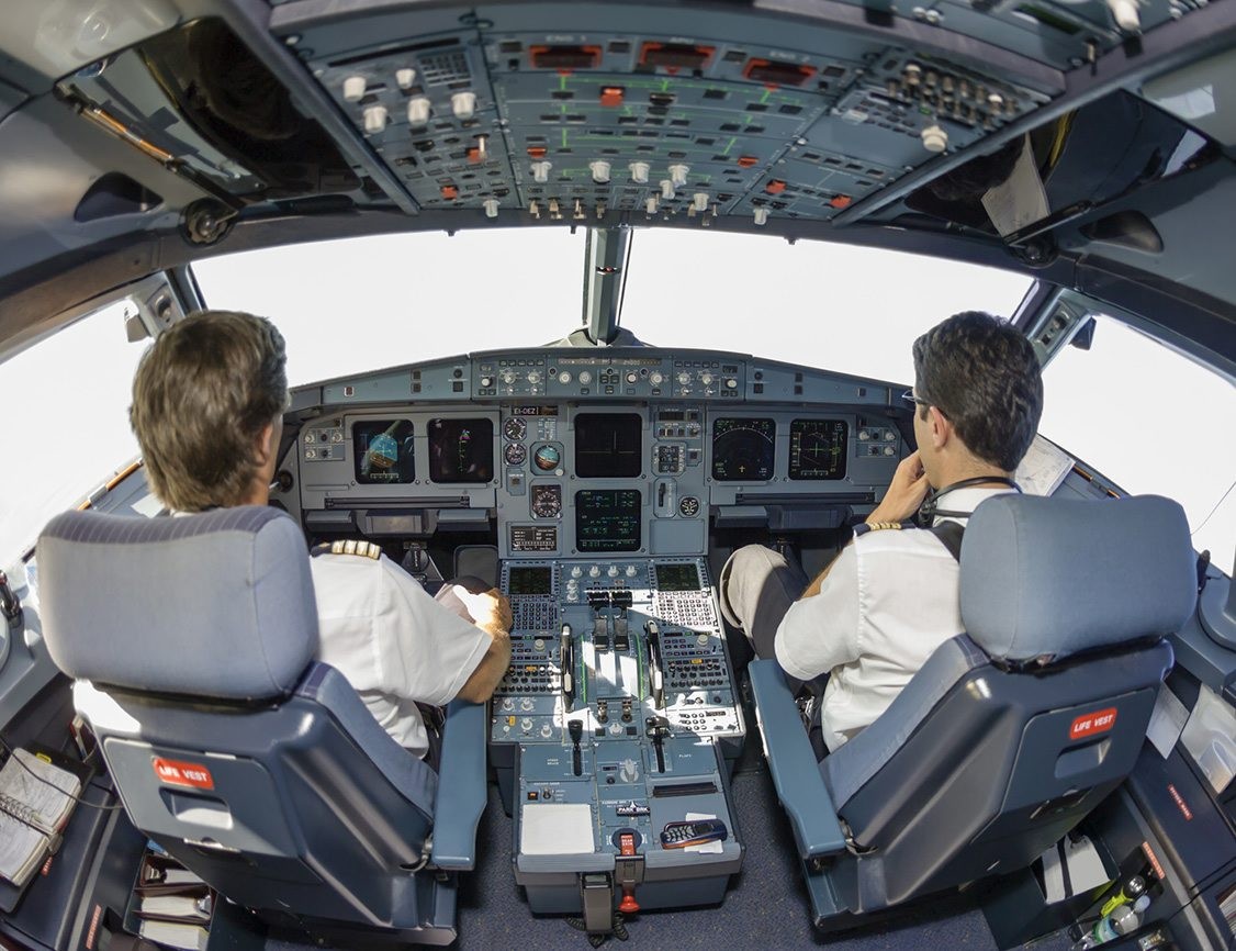 Pilots in an airplane cockpit Pilots in an airplane cockpit