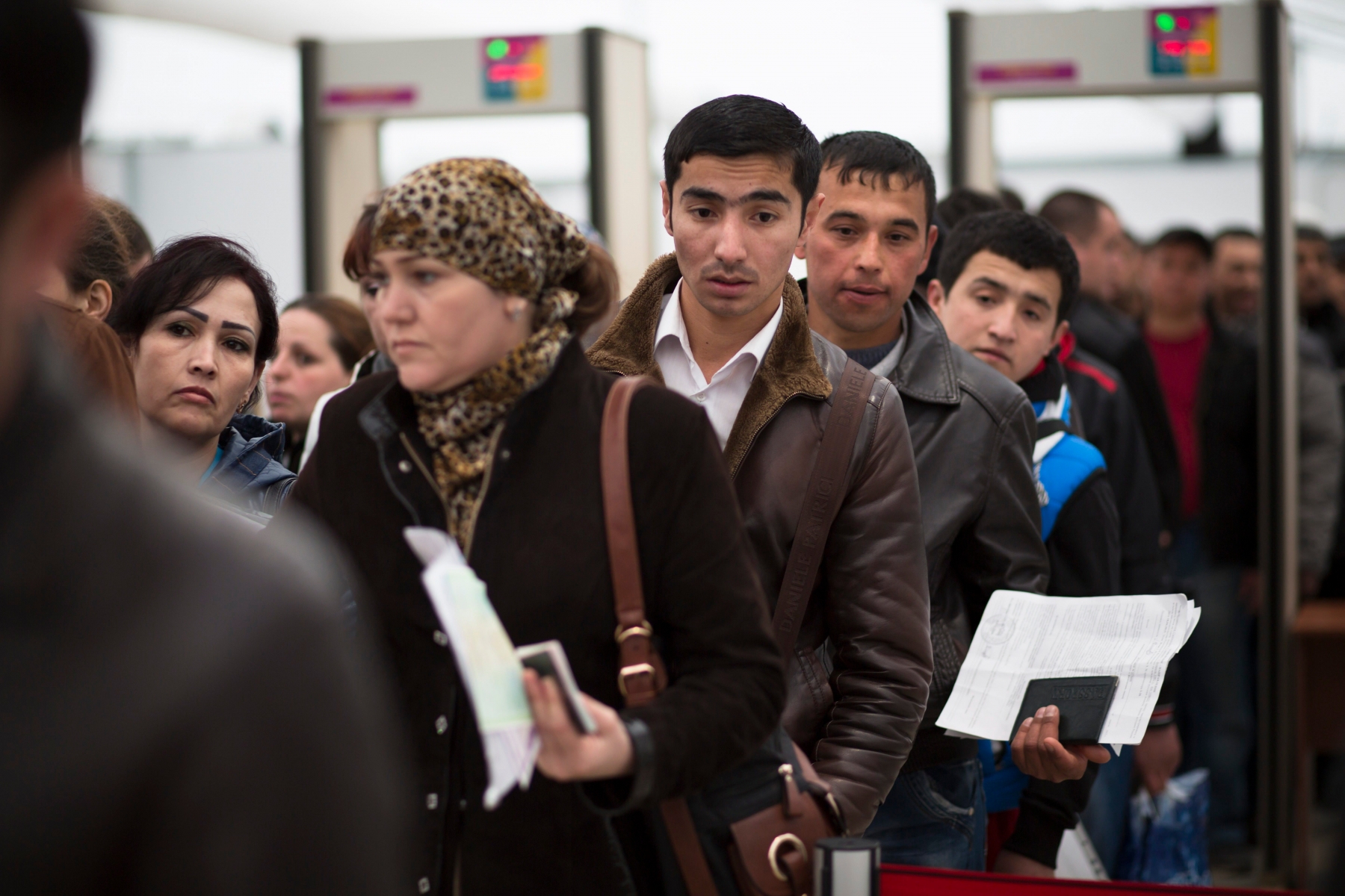 ATTN TONY HICKS.In this photo taken on Wednesday, April  22, 2015, Migrants stand in line to register at Moscow's migration center in Sakharovo, a village about 60 kilometers (35 miles) south of Moscow, Russia. Moscow's migration center works 24 hours a day, seven days a week to process work-permit applications from the flood of people from other former Soviet states who travel to the Russian capital in search of work. (AP Photo/Alexander Zemlianichenko) RUSSLAND MIGRATION