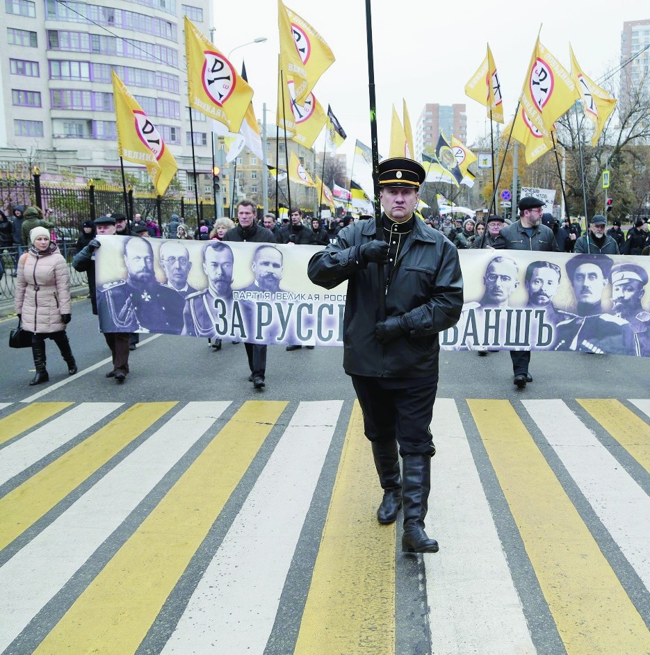 epa05010610 Russian nationalists take part in the so-called 'Russian March' in Pokrovskoe-Streshnevo district of Moscow, Russia, 04 November 2015, marking National Unity Day. The annual Russian March is timed to coincide with the Day of Popular Unity, a national holiday which this year marks the expulsion of Polish occupiers from the Kremlin in 1612.  EPA/MAXIM SHIPENKOV RUSSIA RUSSIAN MARCH