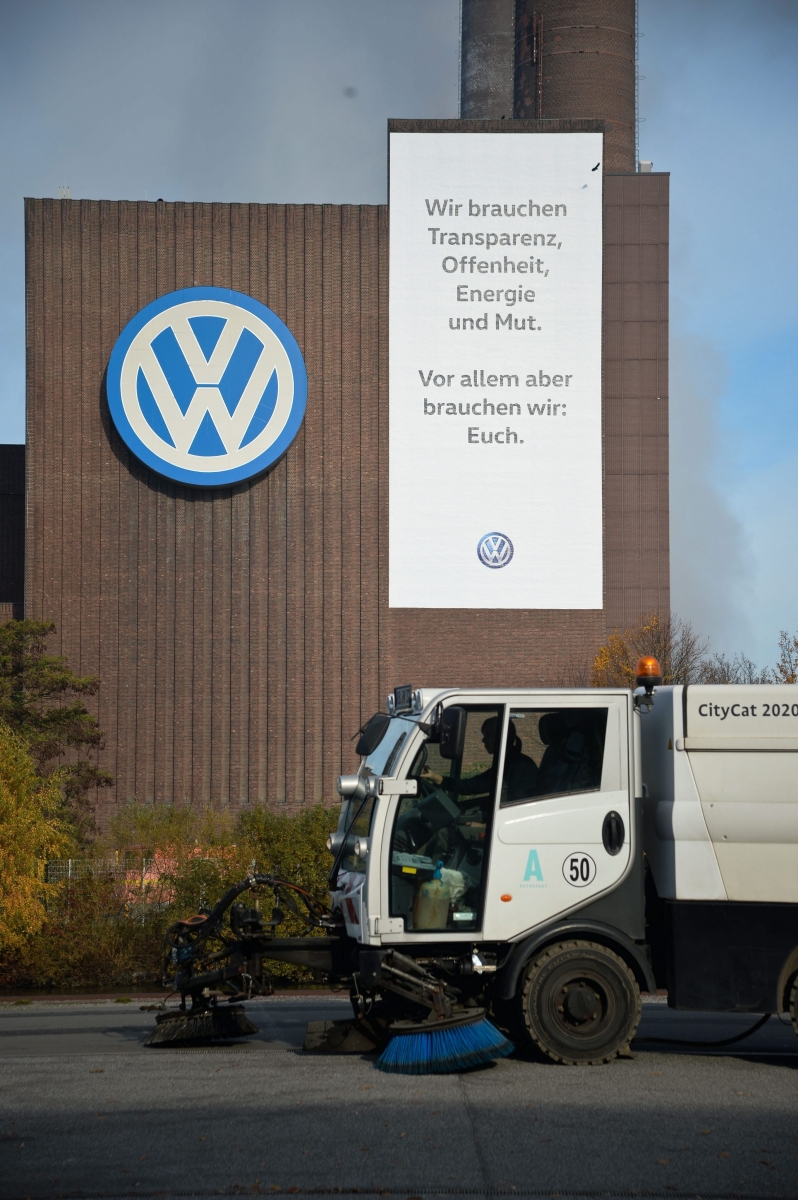 epa05010285 A banner reading 'We need transparency, openness, energy, and courage. Above all we need: you' hangs on the power plant of the VW factory next to the VW logo in Wolfsburg, Germany, 04 November 2015. German carmaker Volkswagen saw its shares lose more than 9 per cent of their value in early trading Wednesday as investors reacted to the latest news in the company's emissions cheating scandal. Volkswagen revealed a day earlier that emissions irregularities have been found in an additional 800,000 Volkswagen cars, representing an economic risk to Europe's biggest carmaker of about 2 billion euros (2.2 billion dollars). The scandal, which broke in September, had already affected 11 million cars with diesel engines that were installed with software that allowed cars to falsely report lower emissions of nitrogen oxide in an effort to sidestep environmental regulations.  EPA/PETER STEFFEN GERMANY VOLKSWAGEN