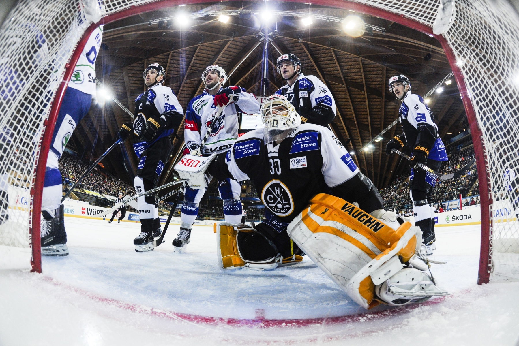 Lugano's goalkeeper Elvis Merzlikins, center, is pictured during the game between Switzerland's HC Lugano and Germany's Adler Mannheim, at the 89th Spengler Cup ice hockey tournament in Davos, Switzerland, on Saturday, December 26, 2015. (KEYSTONE/Gian Ehrenzeller)