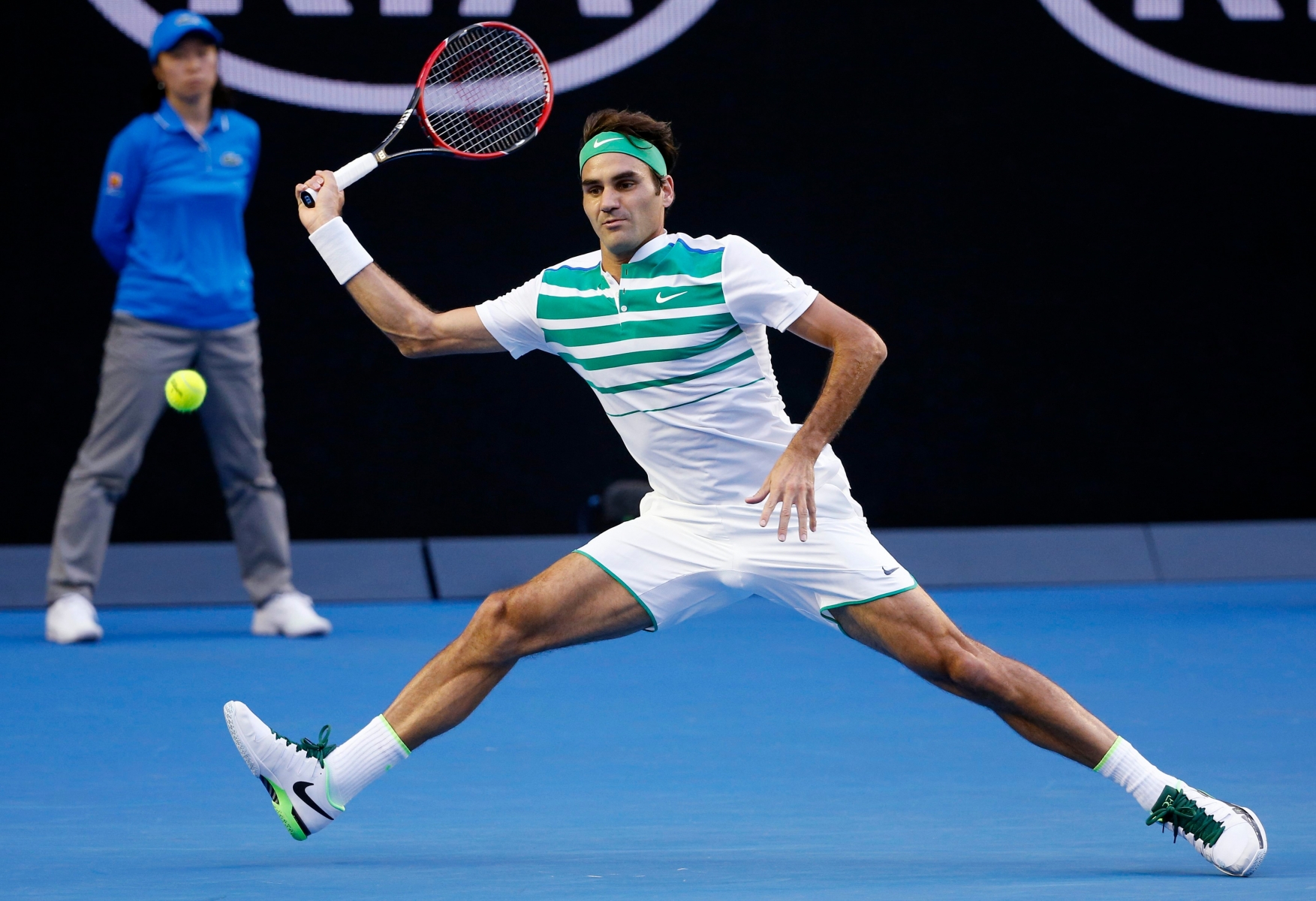 Roger Federer of Switzerland makes a forehand return during his first round match against Nikoloz Basilashvili of Georgia at the Australian Open tennis championships in Melbourne, Australia, Monday, Jan. 18, 2016.(AP Photo/Vincent Thian) APTOPIX Australian Open Tennis