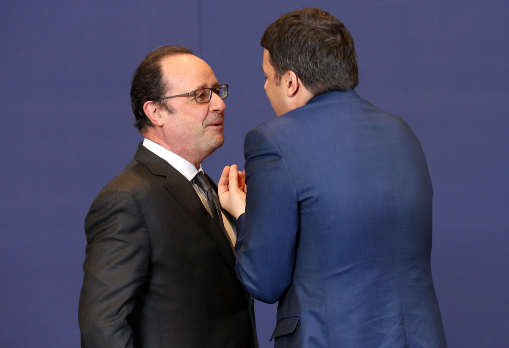 Le président français François Hollande (à gauche) préfère rester prudent sur l'avancée des négociations.