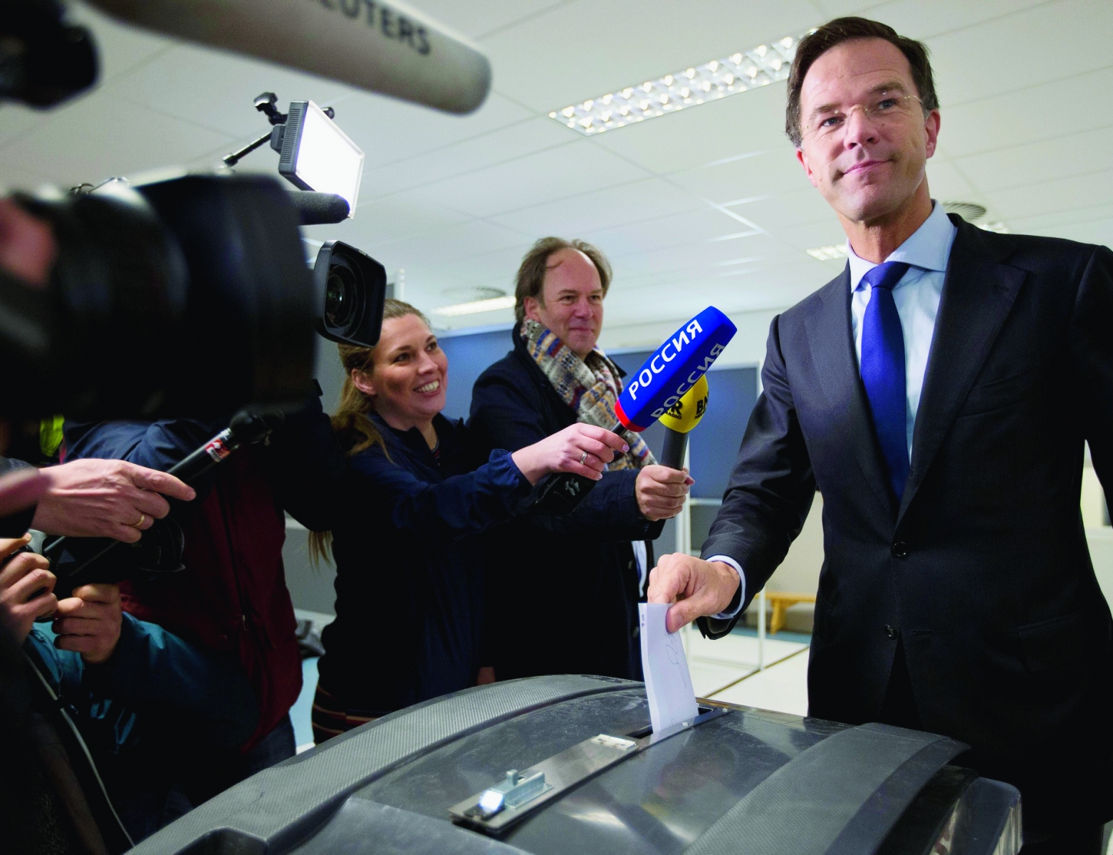 Dutch Prime Minister Mark Rutte casts his vote in a non-binding referendum on the EU-Ukraine association agreement in The Hague, Netherlands, Wednesday, April 6, 2016. The vote is seen by opponents of the 28-nation EU bloc as an opportunity to express their anger at what they consider unwanted expansionism and a lack of democratic rights for EU citizens, three months before British citizens decide in their own referendum whether to leave the EU altogether. (AP Photo/Peter Dejong) Netherlands EU Ukraine Referendum