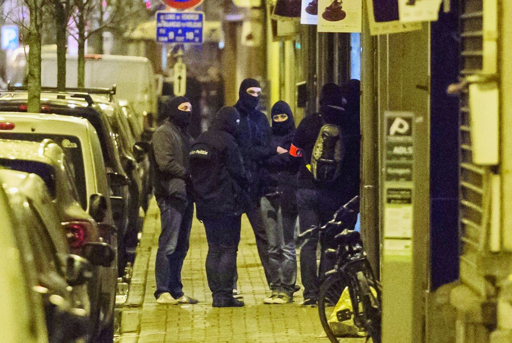 Police investigate an area where terror suspect Mohamed Abrini was arrested earlier today, in Brussels on Friday April 8, 2016. The federal prosecutor's office confirmed a fugitive suspect in the Nov. 13 Paris attacks was arrested in Belgium on Friday, after a raid Belgian authorities said was linked to the deadly March 22 Brussels bombings. The suspect, Mohamed Abrini, is believed to be the mysterious "man in the hat" who escaped the double bombing at Brussels airport, but further investigation is needed to determine Abrini is the third suspect of the airport attack. (AP Photo/Geert Vanden Wijngaert) Belgium Attacks