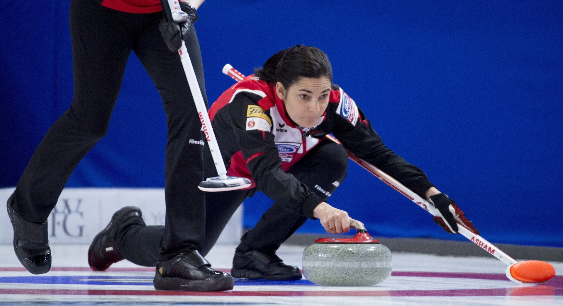 Switzerland skip Binia Feltscher makes a shot during the sixth draw against Finland at the Women's World Curling Championship in Swift Current, Saskatchewan, Monday, March 21, 2016. (Jonathan Hayward/The Canadian Press via AP) MANDATORY CREDIT