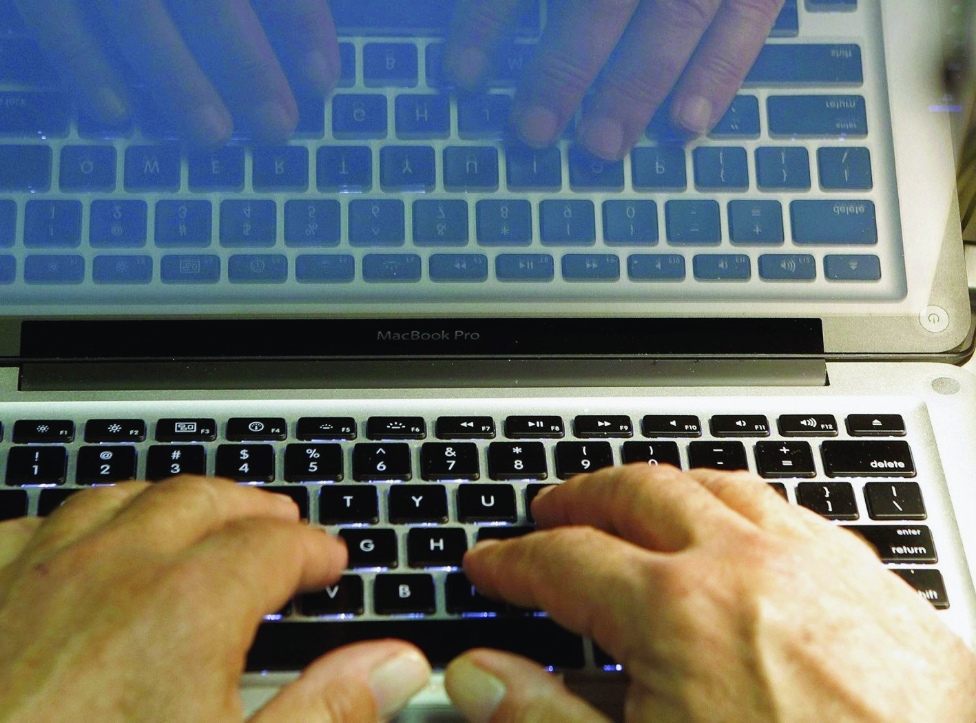 FILE - In this Feb. 27, 2013, file photo illustration, hands type on a computer keyboard in Los Angeles. As tax day nears, phishing season is in full swing. The IRS says itís seen a ìsurgeî in phishing emails in 2016. And thieves are also baiting special hooks for payroll and human resources workers, in hopes of snagging a companyís entire stash of employee information. (AP Photo/Damian Dovarganes, File) Phishing-Tax Season