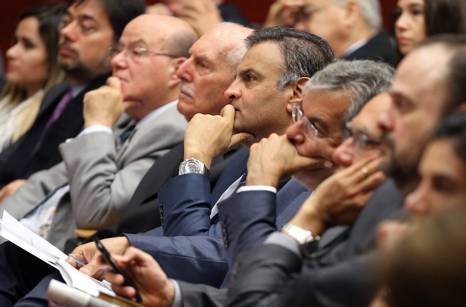 FILE - In this March 31 2016 file photo, Brazilian Senator Aecio Neves, center, listens during at a legal conference in Lisbon, Portugual. Neves, the Brazilian opposition PSDB partyís 2014 presidential candidate who narrowly lost to the now-embattled incumbent President Dilma Rousseff, was named among many top officials to be investigated for corruption, authorized by Brazil's attorney general according to Brazilian news reports on Monday, May 2, 2016.  (AP Photo/Armando Franca, File) Portugal Brazil Crisis