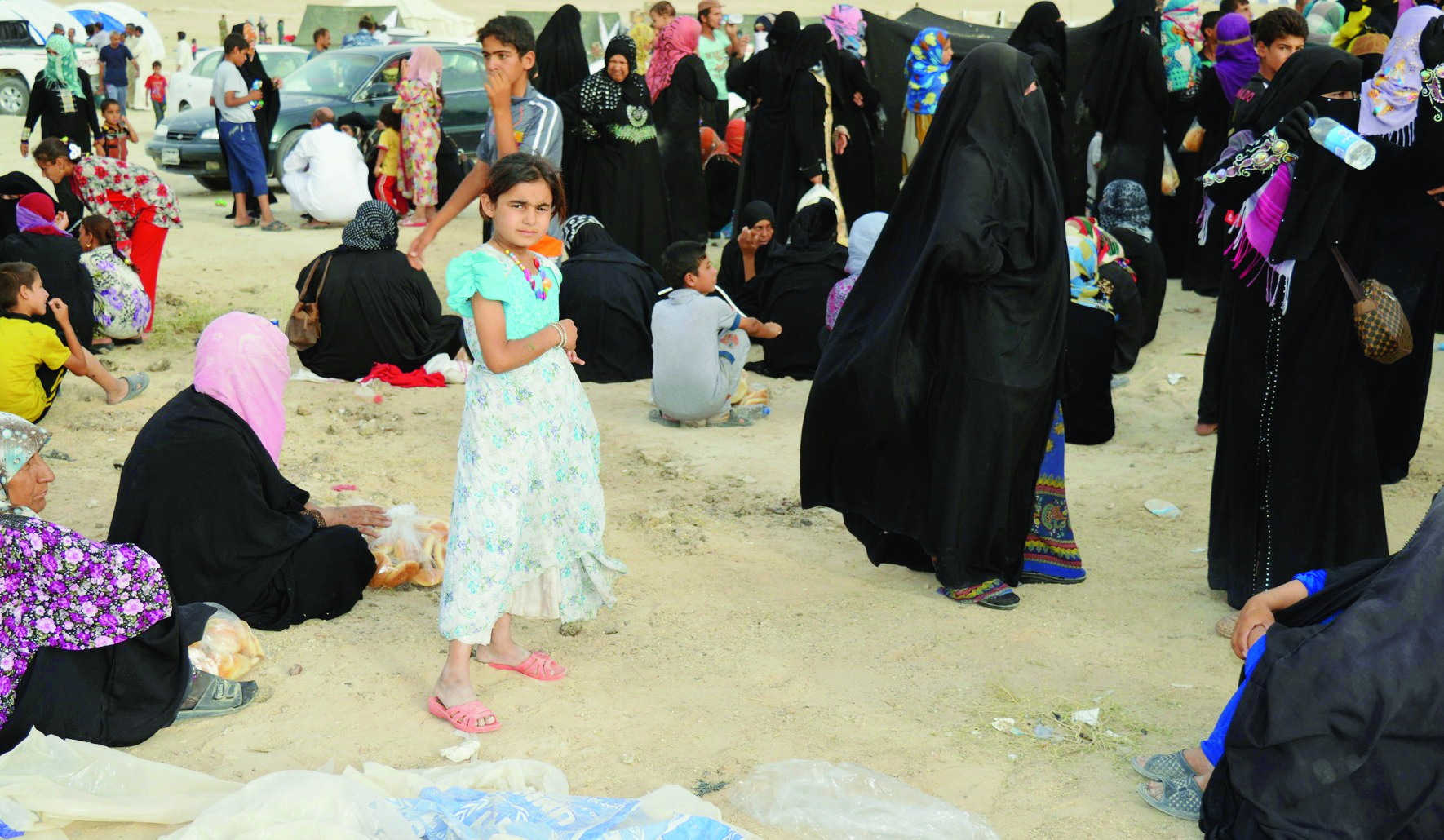 Internally displaced civilians from Fallujah, who fled their homes during fighting between Iraqi security forces and Islamic State group, arrive to a camp outside Fallujah, Iraq, Monday, June 20, 2016.  The U.N. refugee agency says just over 65 million people were displaced worldwide by the end of last year, easily setting a new postwar record, as it warned that European and other rich nations can expect the tide to continue if root causes aren't addressed. (AP Photo) United Nations Refugees