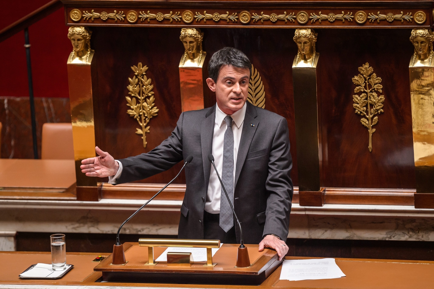 epa05409040 French Prime Minister Manuel Valls delivers a speech during a debate on the disputed planned labour law reforms at the French National Assembly, in Paris on 05 July, 2016. The French cabinet had in May invoked the Constitution's article 49.3, a rarely used article that allows to pass the bill without a parliament vote. The disputed labour law bill has been triggering violent protests and clashes since weeks.  EPA/CHRISTOPHE PETIT TESSON FRANCE PARLIAMENT LABOR LAW