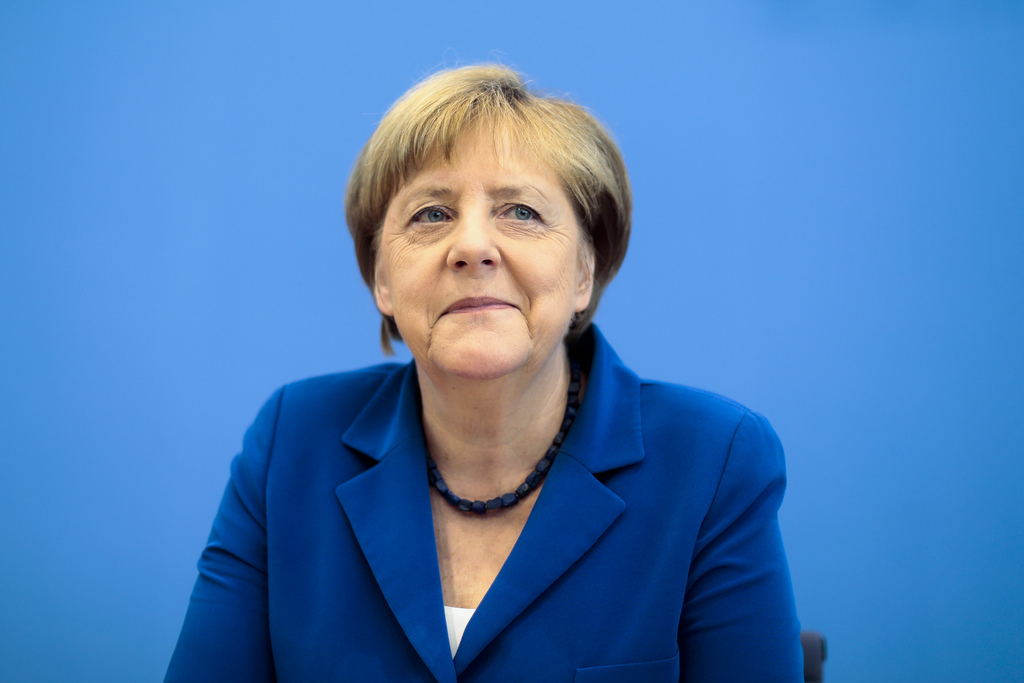 "Je suis aujourd'hui comme hier convaincue que nous allons arriver à mener à bien cette épreuve historique en ces temps de mondialisation", a déclaré Angela Merkel.