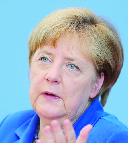 epa05445327 German Chancellor Angela Merkel delivers remarks during a press briefing on domestic and foreign policy issues at the Bundespressekonferenz (lit.†Federal Press Conference) in Berlin,†Germany, 28 July 2016. Chancellor Merkel says Germany will 'stick to our principles' and give shelter to those who deserve it', while refusing calls to change refugee policy despite recent terror attacks.  EPA/KAY†NIETFELD GERMANY GOVERNMENT FOREIGN POLICY