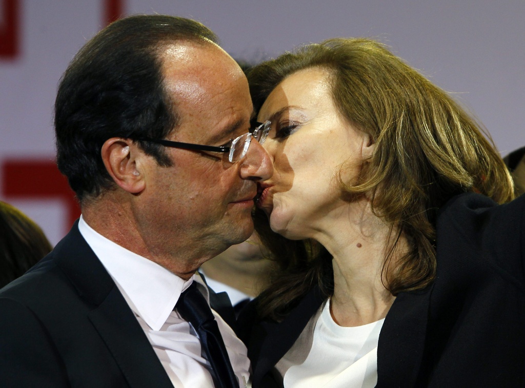 French president-elect Francois Hollande kisses his companion Valerie Trierweiler after greeting crowds gathered to celebrate his election victory in Bastille Square in Paris, France, Sunday, May 6, 2012. France handed the presidency Sunday to leftist Hollande, a champion of government stimulus programs who says the state should protect the downtrodden - a victory that could deal a death blow to the drive for austerity that has been the hallmark of Europe in recent years. (AP Photo/Francois Mori)