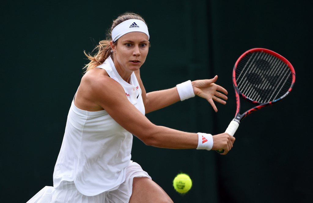 epa05395194 Stefanie Voegele of Switzerland returns to Jelena Jankovic of Serbia during their match on the first round of the Wimbledon Championships at the All England Lawn Tennis Club, in London, Britain, 27 June 2016  EPA/FACUNDO ARRIZABALAGA EDITORIAL USE ONLY/NO COMMERCIAL SALES