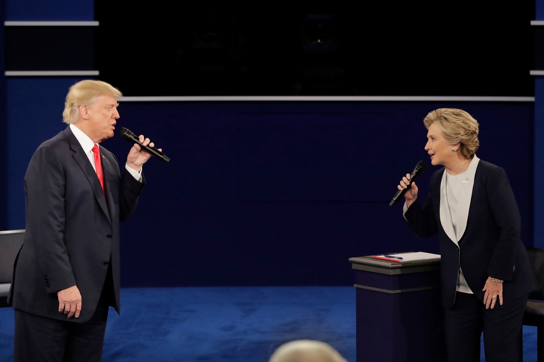 Republican presidential nominee Donald Trump and Democratic presidential nominee Hillary Clinton exchange ideas during the second presidential debate at Washington University in St. Louis, Sunday, Oct. 9, 2016. (AP Photo/Julio Cortez)

 Campaign 2016 Debate