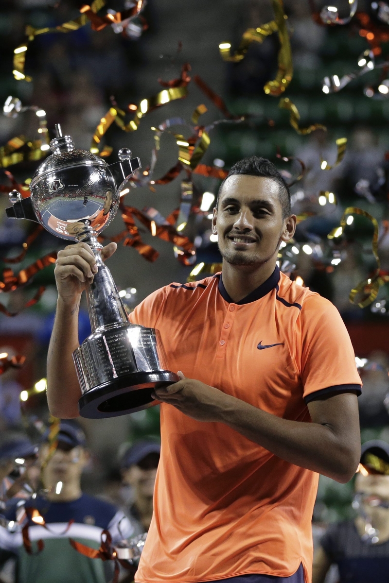 epa05577436 Nick Kyrgios of Australia holds the trophy after winning the men's singles final match against David Goffin of Belgium at the Japan Open Tennis Championships in Tokyo, Japan, 09 October 2016.  EPA/KIYOSHI OTA
